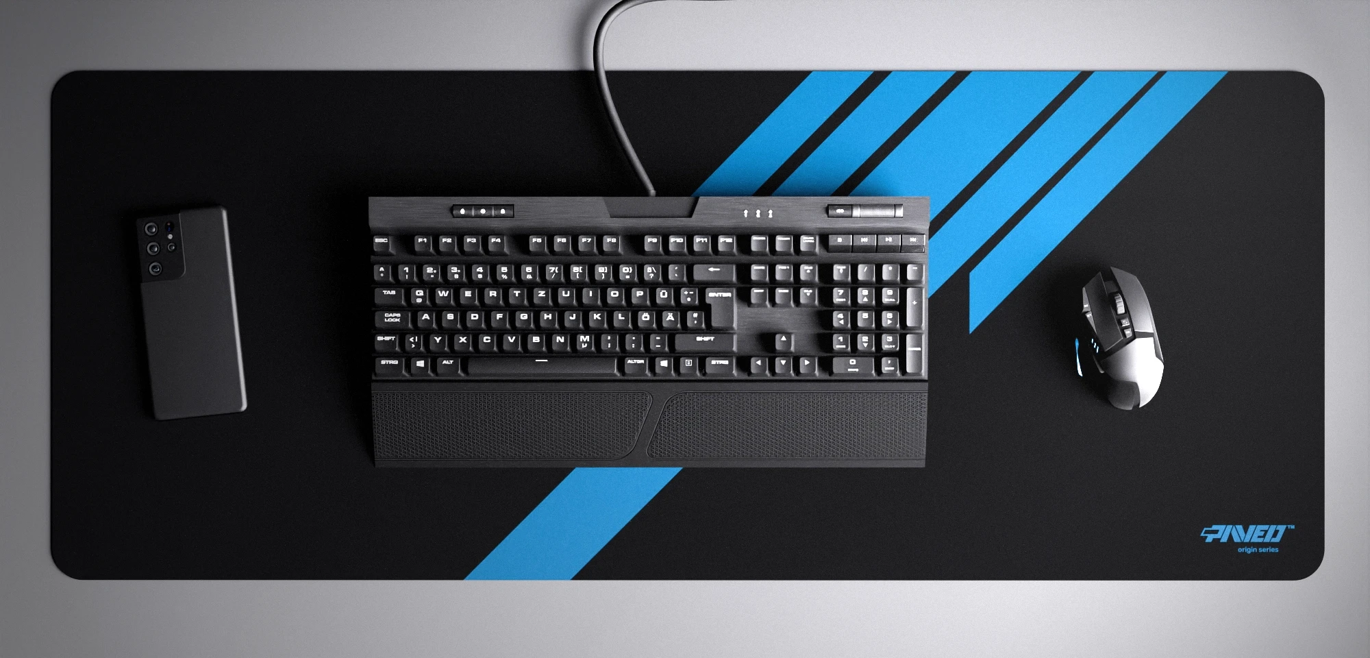 Top view of Night Sky Blade Runner XXL deskmat 1000mm x 400mm right-handed variant with minimalistic diagonal stripe design in blue and black, hydrophobic easy-to-clean antimicrobial surface, shown with full-size mechanical keyboard, gaming mouse, and smartphone for scale, 600% lighter non-slip base with no rubbery smell, durable stitch-free edges.