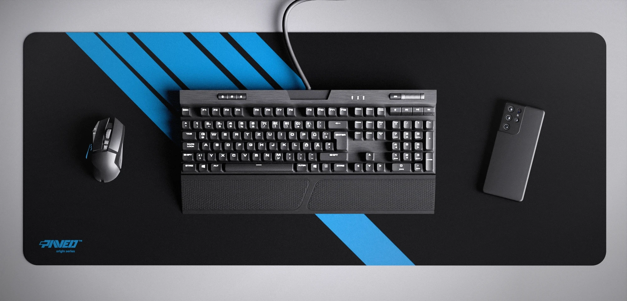 Top view of Night Sky Blade Runner XXL deskmat 1000mm x 400mm left-handed variant featuring diagonal stripe design in blue and black, water-resistant antimicrobial polyester surface, shown with full-size mechanical keyboard, gaming mouse, and smartphone for scale, ultra-lightweight odour-free AreoFlex microruber base, stitch-free professional finish.