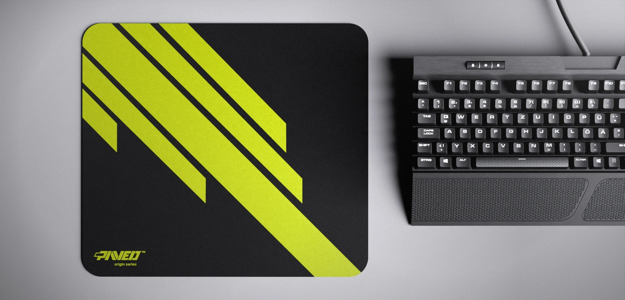 Top view of Night Toxic Blade Runner M size mousepad 360mm x 320mm left-handed variant with minimalistic light green diagonal stripe design on black background, water-resistant antimicrobial polyester surface, shown with full-size mechanical keyboard for scale, ultra-lightweight odour-free AreoFlex base, stitch-free edges.