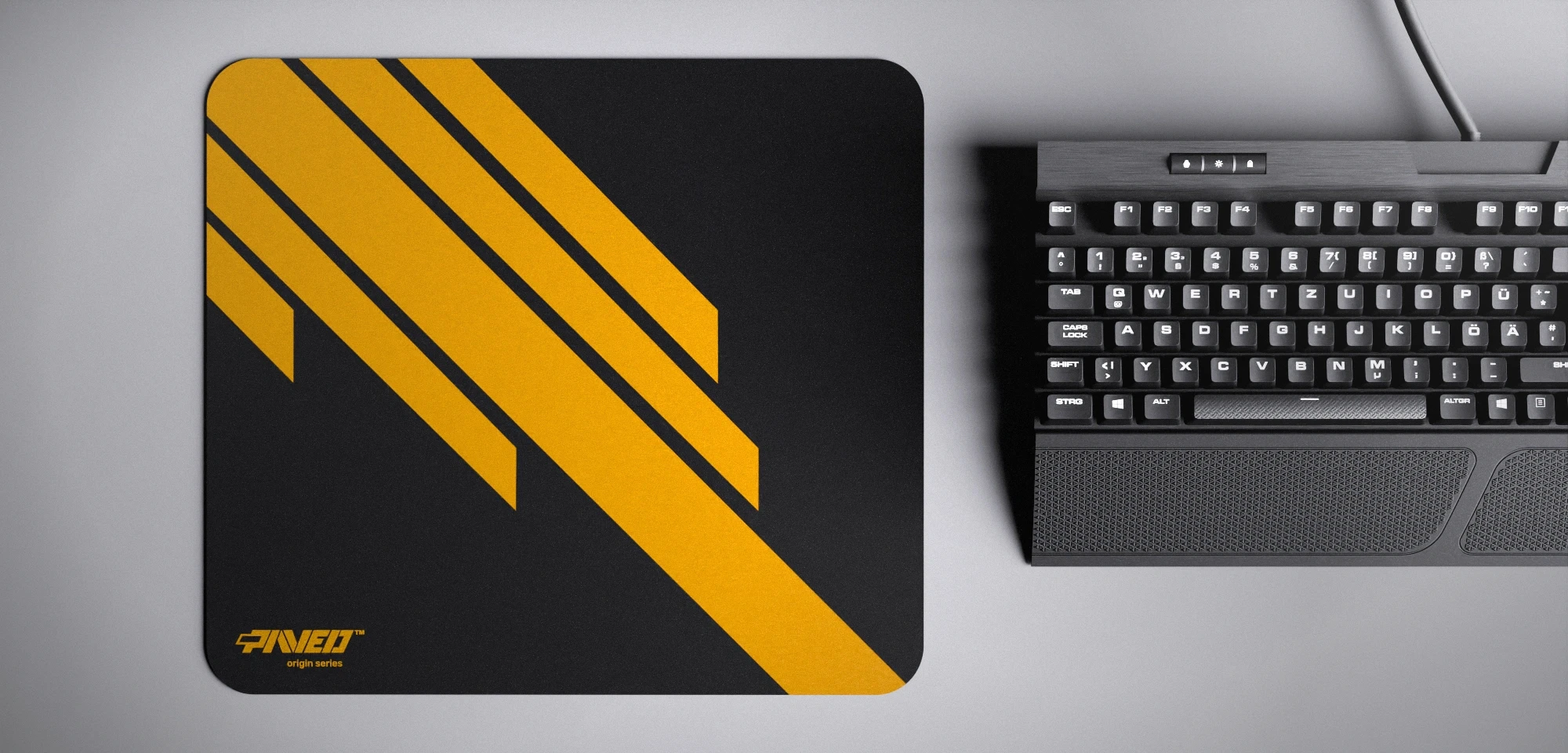 Top view of Night Desert Blade Runner M size mousepad 360mm x 320mm left-handed variant with minimalistic deep yellow diagonal stripe design on black background, water-resistant antimicrobial polyester surface, shown with full-size mechanical keyboard for scale, ultra-lightweight odour-free AreoFlex base, stitch-free edges.