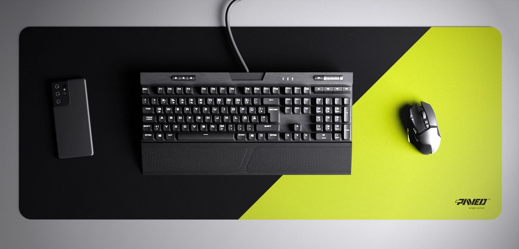 Top view of Toxic Edge Runner XXL deskmat 1000mm x 400mm right-handed variant with minimalistic diagonal split design in light green and black, hydrophobic easy-to-clean antimicrobial surface, shown with full-size mechanical keyboard, gaming mouse, and smartphone for scale, 600% lighter non-slip base with no rubbery smell, durable stitch-free edges.