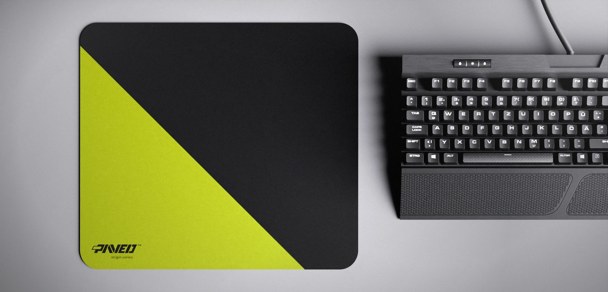 Top view of Toxic Edge Runner M size mousepad 360mm x 320mm left-handed variant with minimalistic light green diagonal split design on black background, water-resistant antimicrobial polyester surface, shown with full-size mechanical keyboard for scale, ultra-lightweight odour-free AreoFlex base, stitch-free edges.