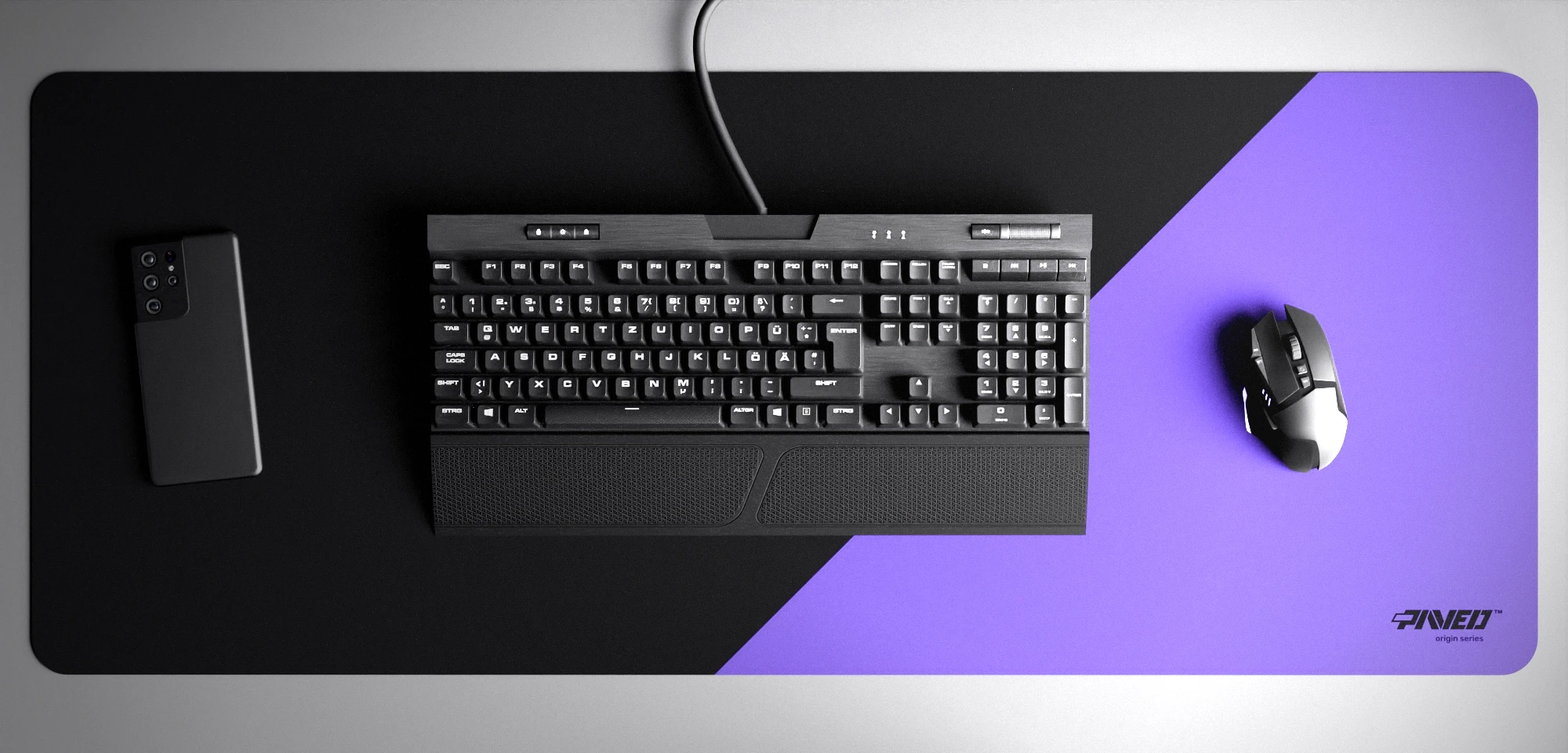 Top view of Amethyst Edge Runner XXL deskmat 1000mm x 400mm right-handed variant with minimalistic diagonal split design in purple and black, hydrophobic easy-to-clean antimicrobial surface, shown with full-size mechanical keyboard, gaming mouse, and smartphone for scale, 600% lighter non-slip base with no rubbery smell, durable stitch-free edges.