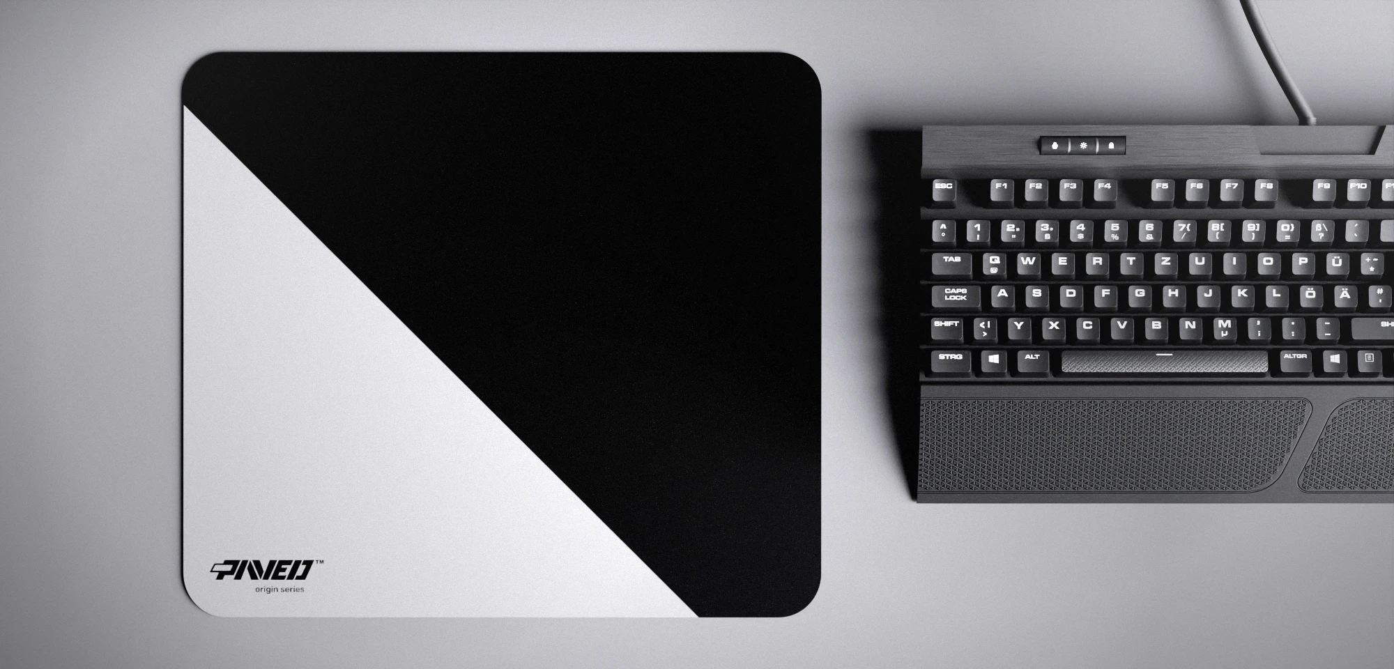 Top view of Polar Edge Runner M size mousepad 360mm x 320mm left-handed variant with minimalistic white diagonal split design on black background, water-resistant antimicrobial polyester surface, shown with full-size mechanical keyboard for scale, ultra-lightweight odour-free AreoFlex base, stitch-free edges.