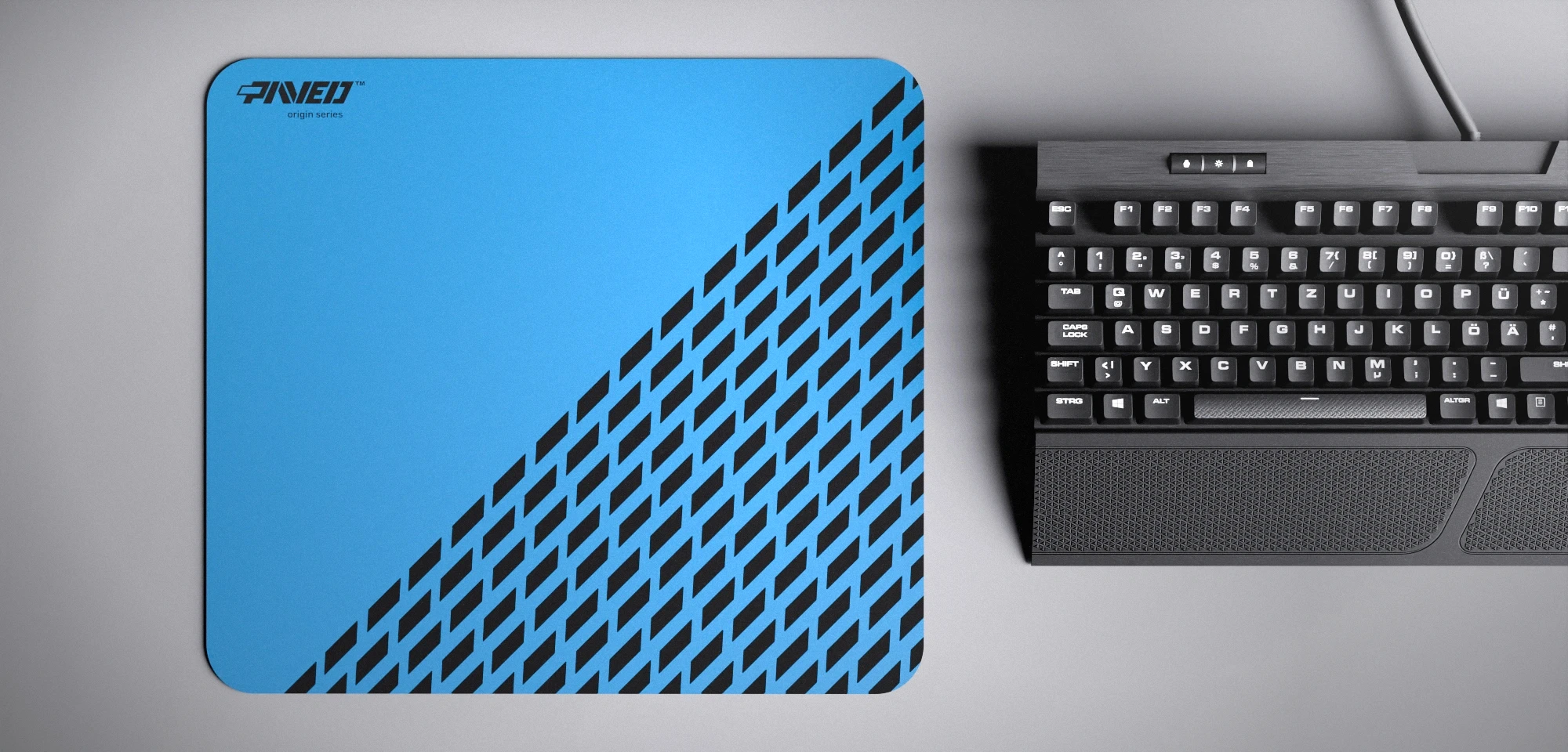Top view of Sky Panther M size mousepad 360mm x 320mm left-handed variant with minimalistic blue geometric panther spot pattern on black background with diagonal split design, water-resistant antimicrobial polyester surface, shown with full-size mechanical keyboard for scale, ultra-lightweight odour-free AreoFlex base, stitch-free edges.