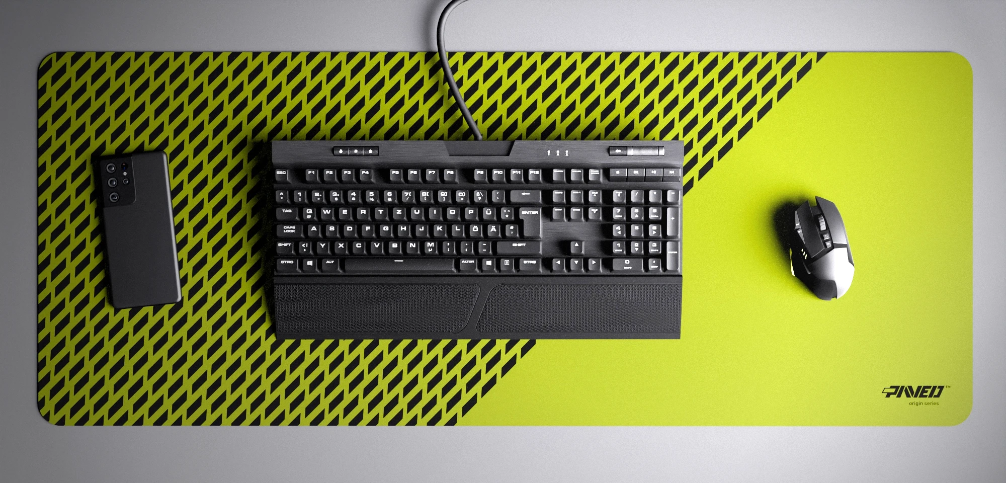 Top view of Toxic Panther XXL deskmat 1000mm x 400mm right-handed variant with minimalistic diagonal split design and geometric panther spot pattern in light green and black, hydrophobic easy-to-clean antimicrobial surface, shown with full-size mechanical keyboard, gaming mouse, and smartphone for scale, 600% lighter non-slip base with no rubbery smell, durable stitch-free edges.