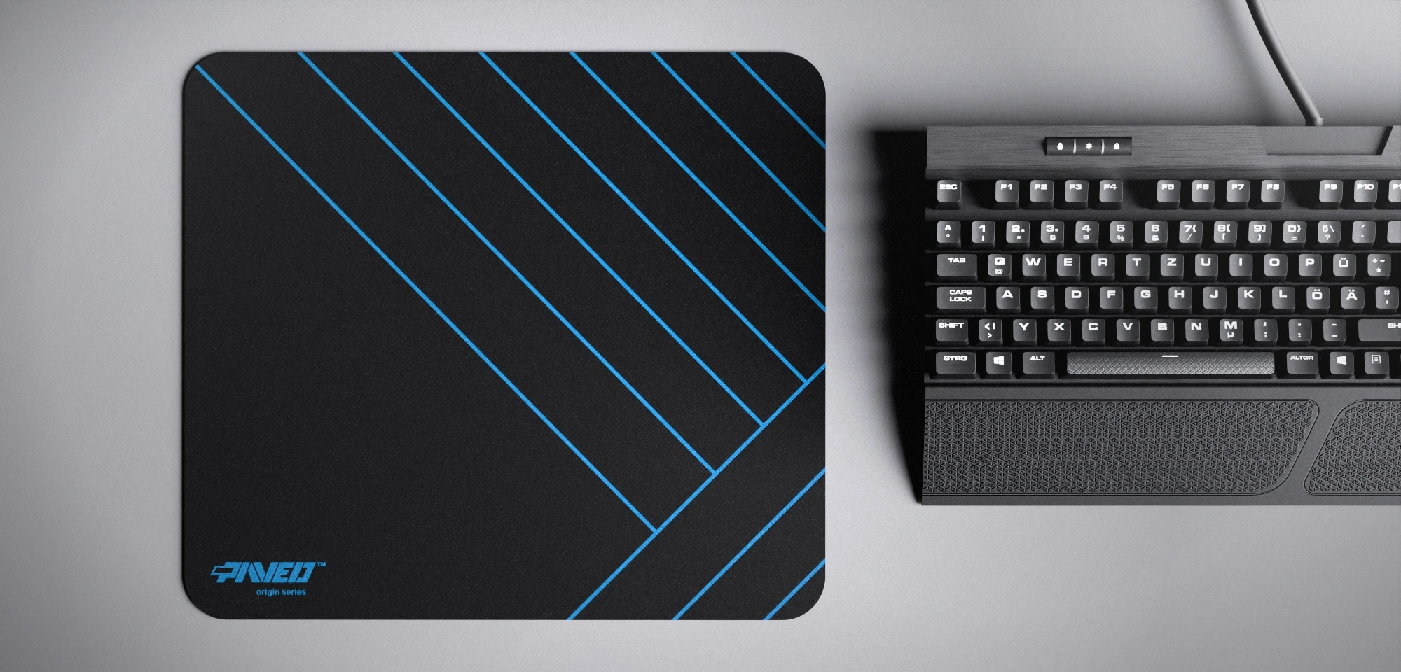 Top view of Night Sky Zebra M size mousepad 360mm x 320mm left-handed variant with minimalistic blue diagonal stripe pattern on black background, water-resistant antimicrobial polyester surface, shown with full-size mechanical keyboard for scale, ultra-lightweight odour-free AreoFlex base, stitch-free edges.