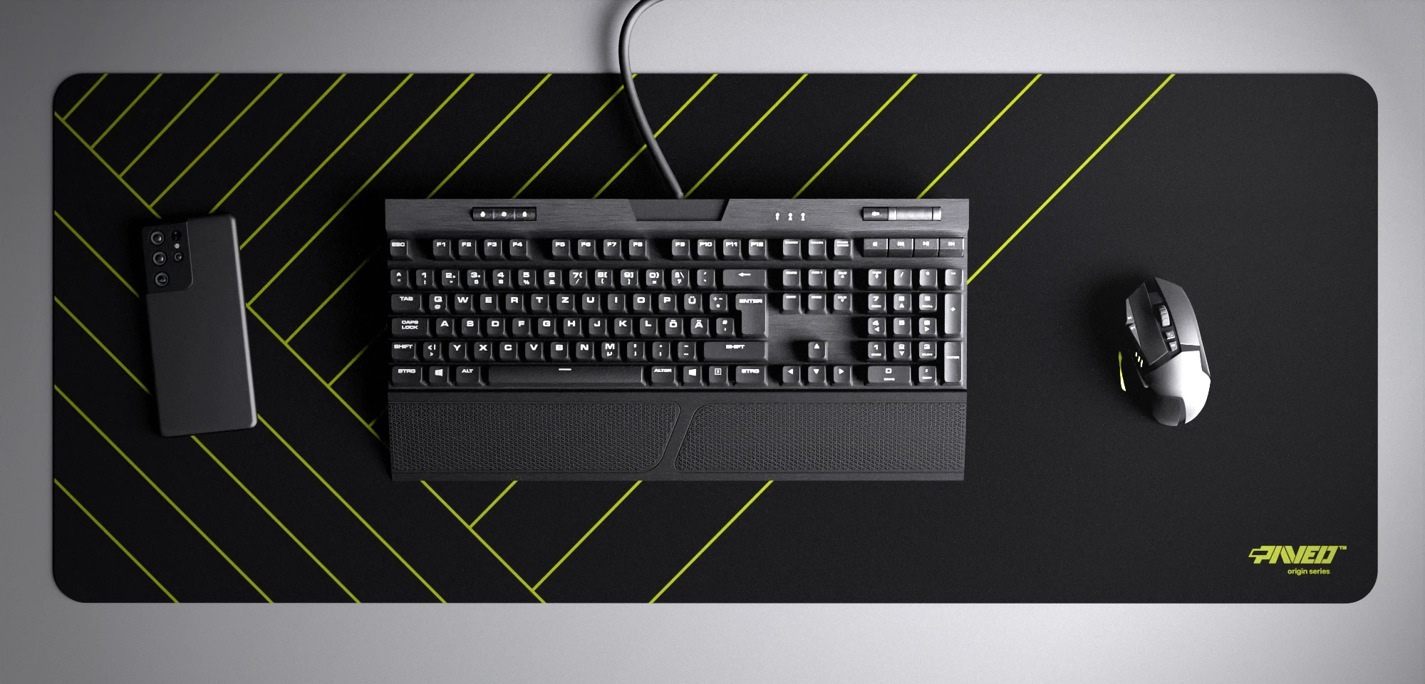 Top view of Night Toxic Zebra XXL deskmat 1000mm x 400mm right-handed variant with minimalistic diagonal stripe pattern in light green and black, hydrophobic easy-to-clean antimicrobial surface, shown with full-size mechanical keyboard, gaming mouse, and smartphone for scale, 600% lighter non-slip base with no rubbery smell, durable stitch-free edges.