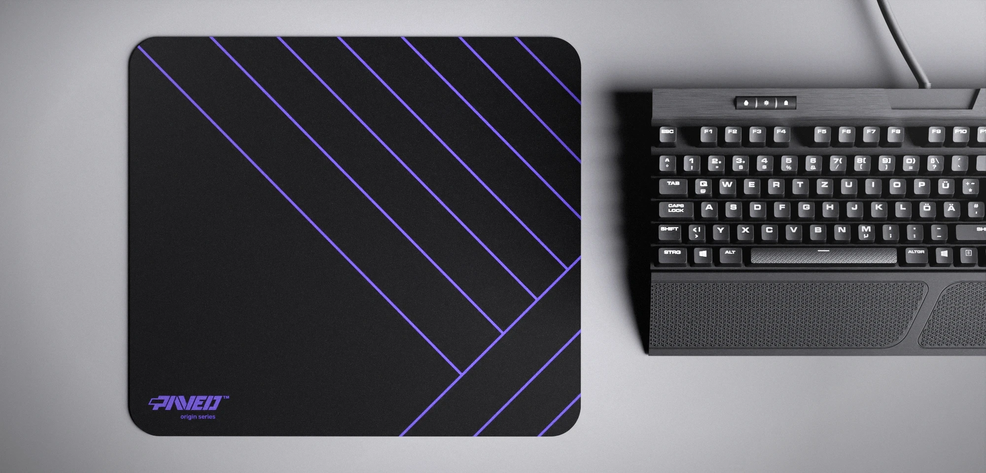 Top view of Night Amethyst Zebra M size mousepad 360mm x 320mm left-handed variant with minimalistic purple diagonal stripe pattern on black background, water-resistant antimicrobial polyester surface, shown with full-size mechanical keyboard for scale, ultra-lightweight odour-free AreoFlex base, stitch-free edges.