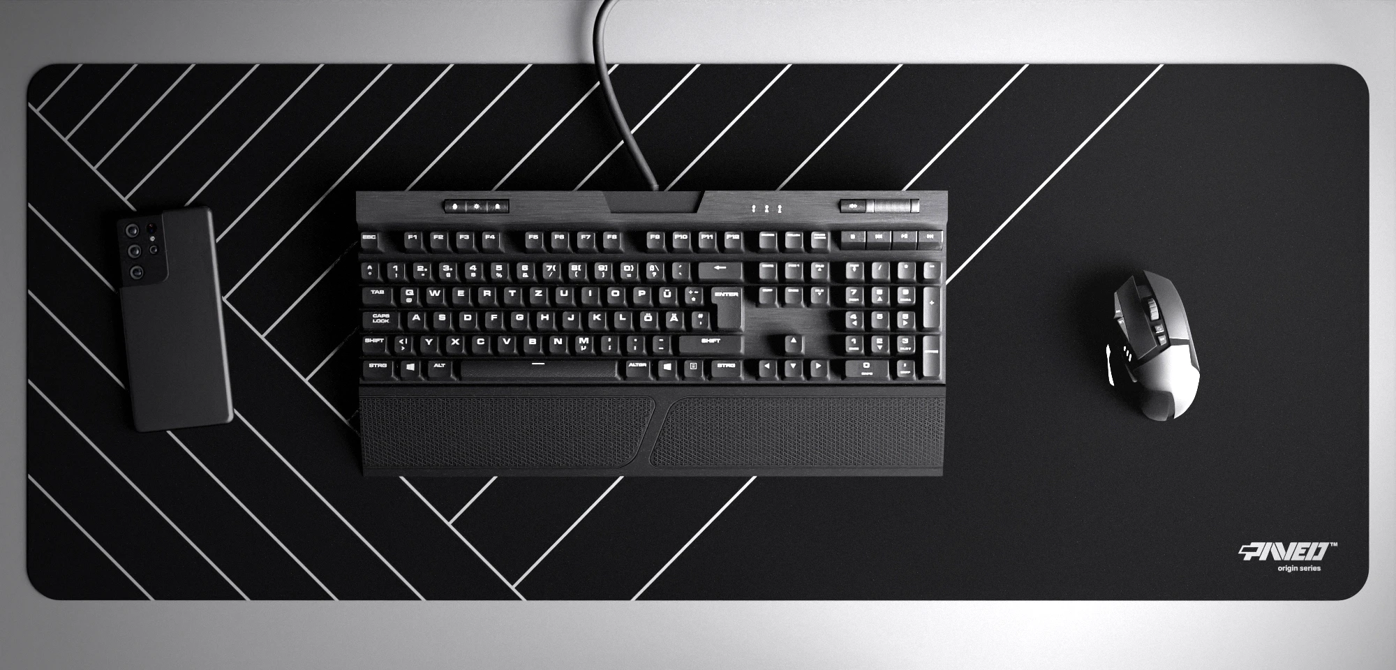 Top view of Night Zebra XXL deskmat 1000mm x 400mm right-handed variant with minimalistic diagonal stripe pattern in white and black, hydrophobic easy-to-clean antimicrobial surface, shown with full-size mechanical keyboard, gaming mouse, and smartphone for scale, 600% lighter non-slip base with no rubbery smell, durable stitch-free edges.