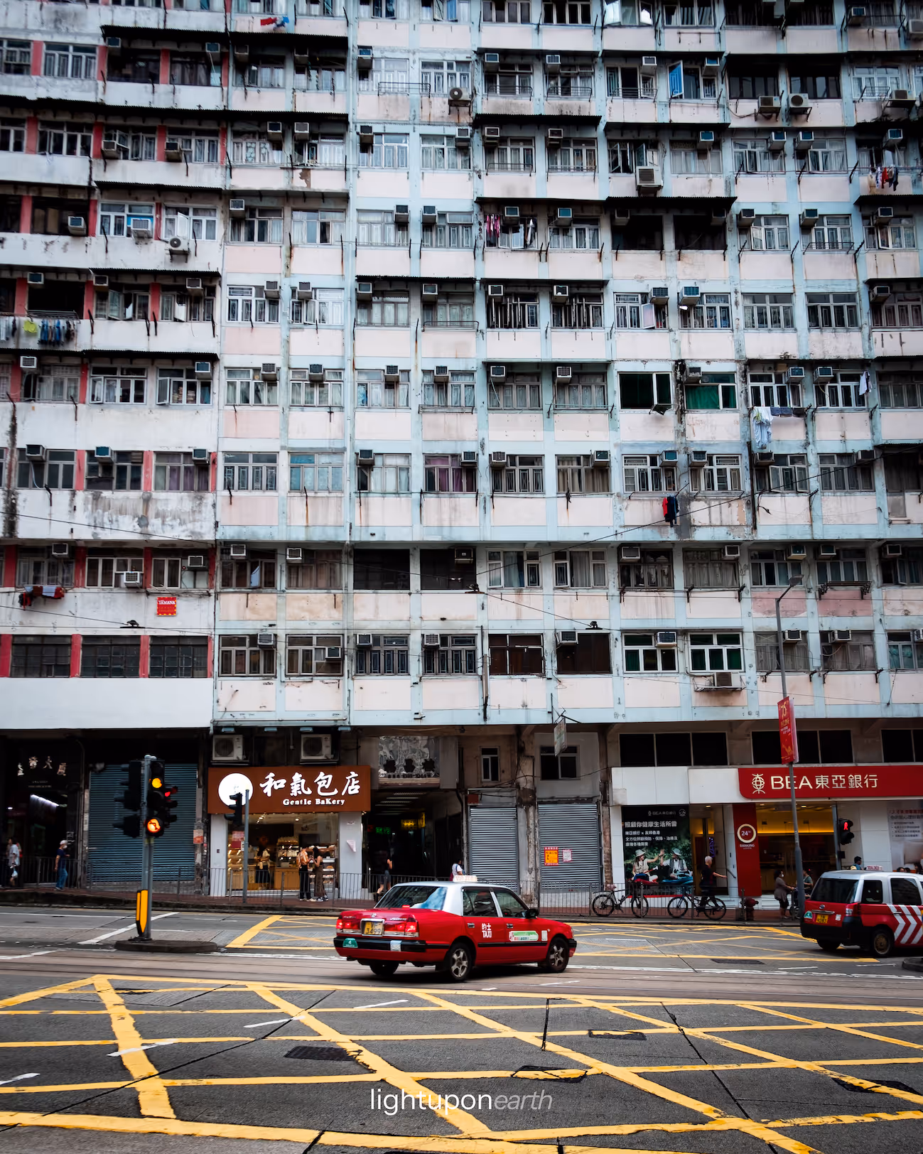Typical red cab in front of monster building