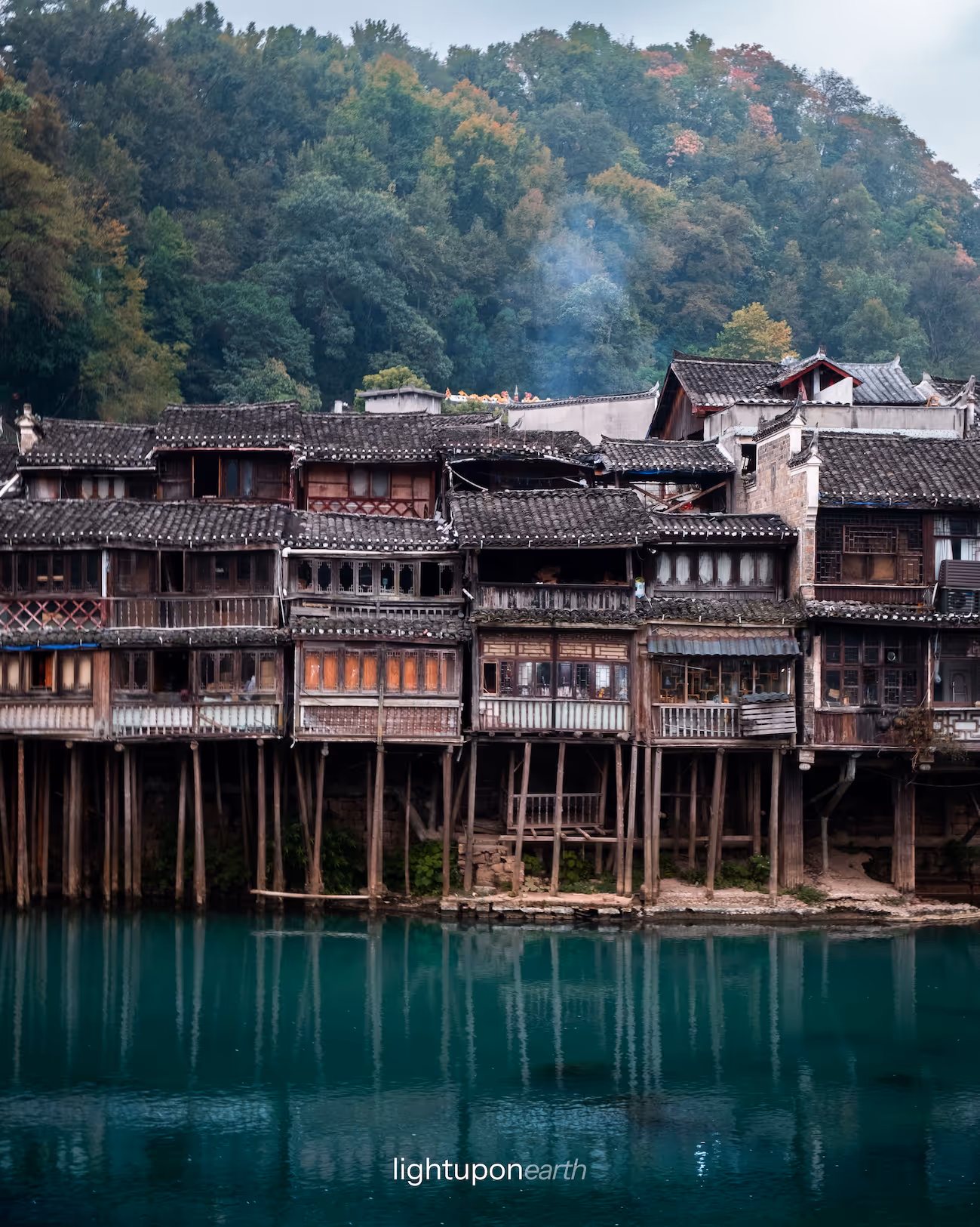 wooden homes suspended over the water