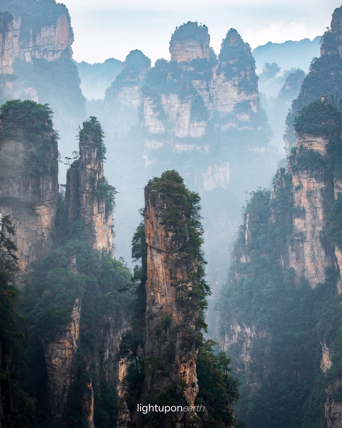rock pinnacles in foggy landscape