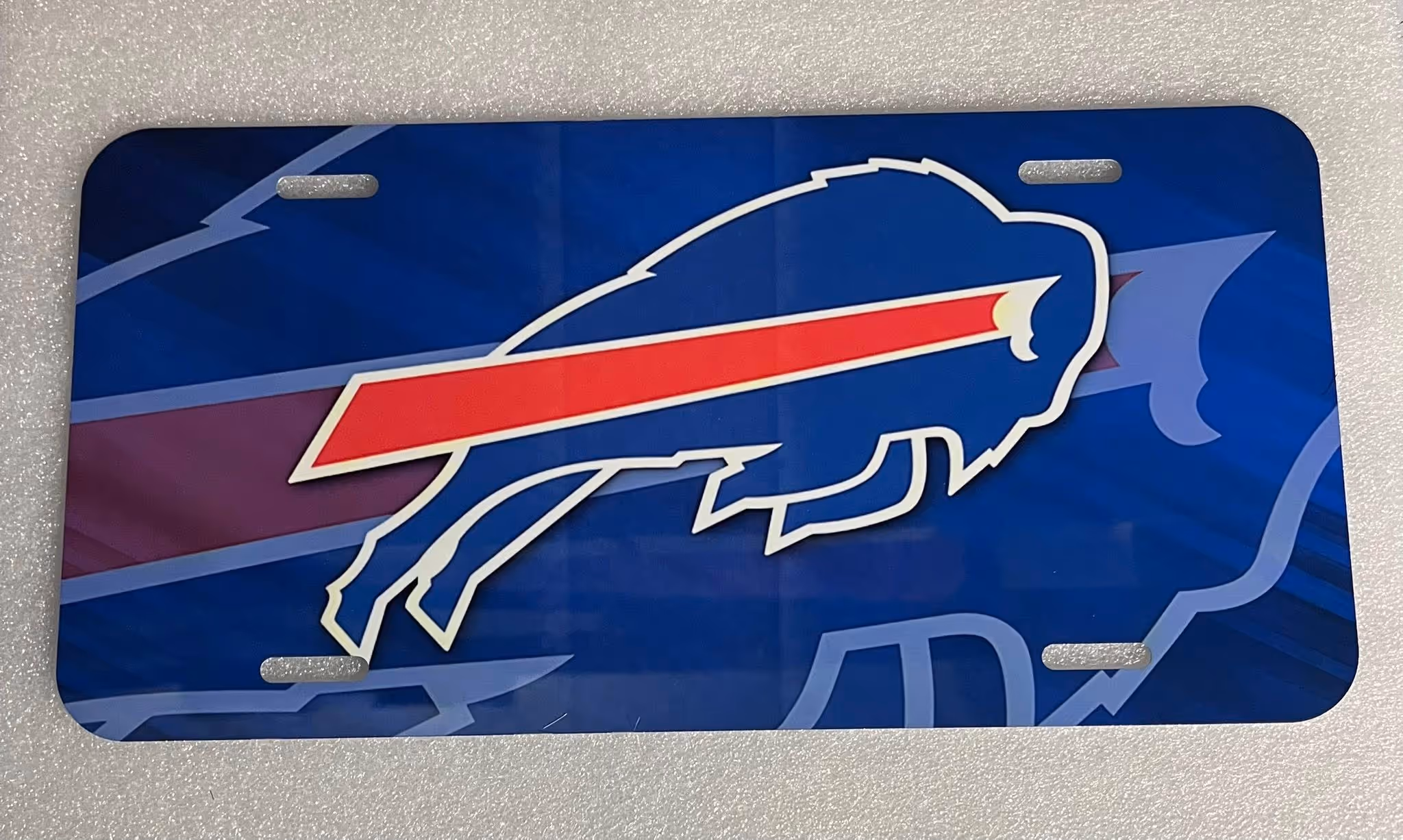 Show your Buffalo pride with Moonstruck Undgrnd’s custom Bills license plates—now available for just $12. Message them on Facebook to order yours today.