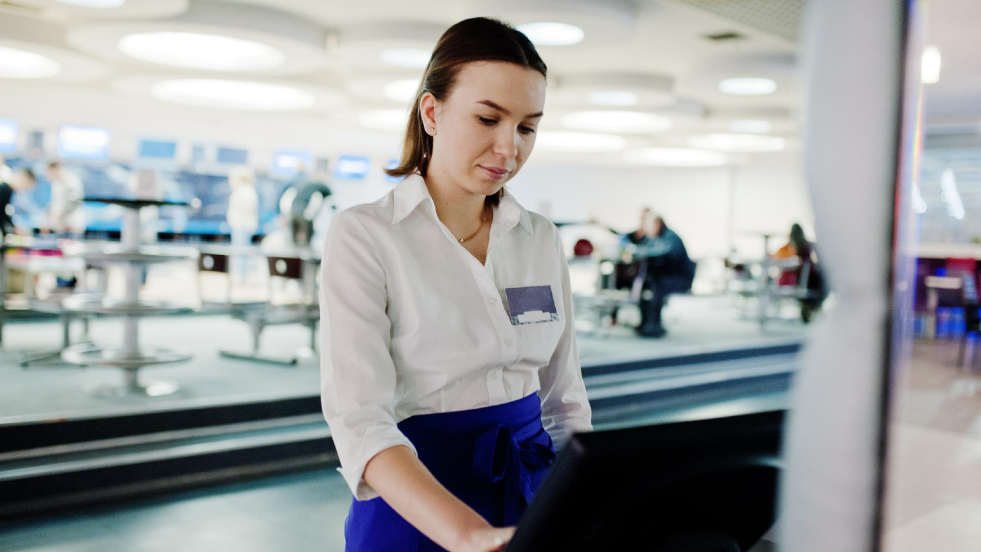 A woman working on a desktop computer.