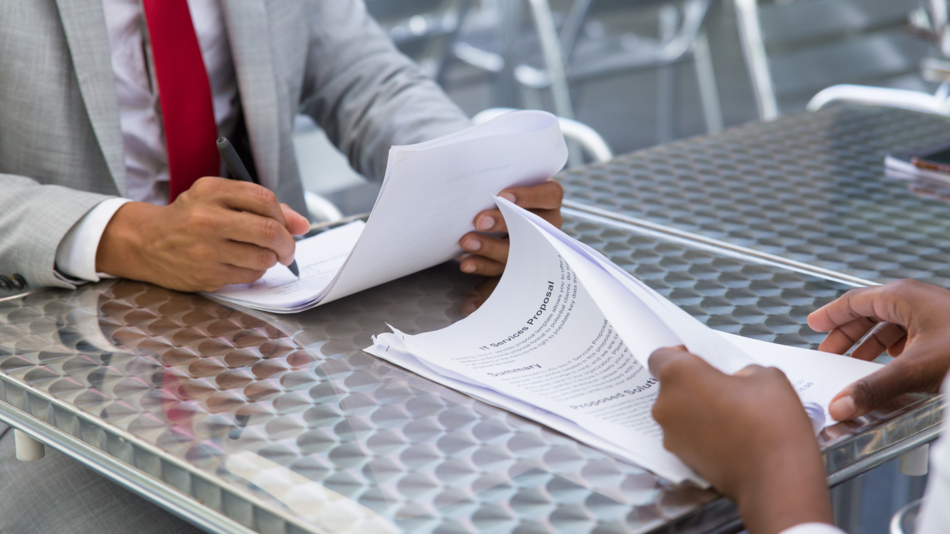Two people reviewing documents.