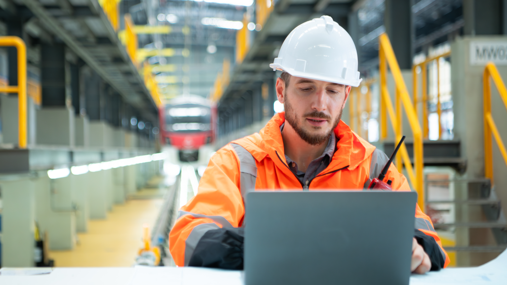 Maintenance manager analyzing inventory levels and work order performance metrics on a laptop.
