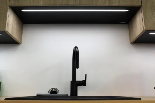 A modern black faucet.