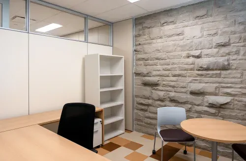 Office space with exposed brick wall