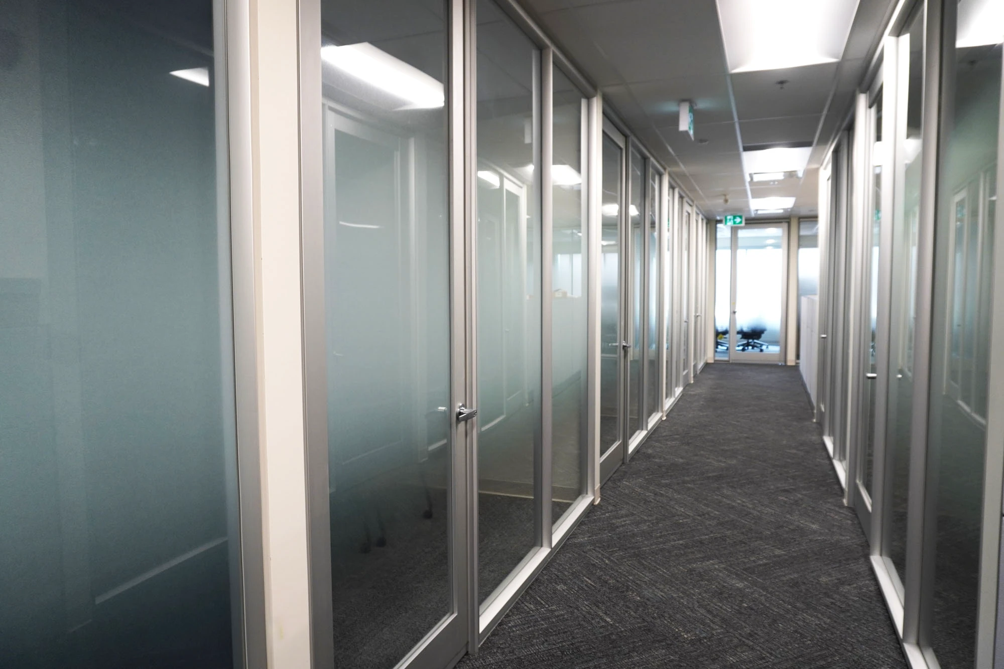 Frosted glass doors in office hallway