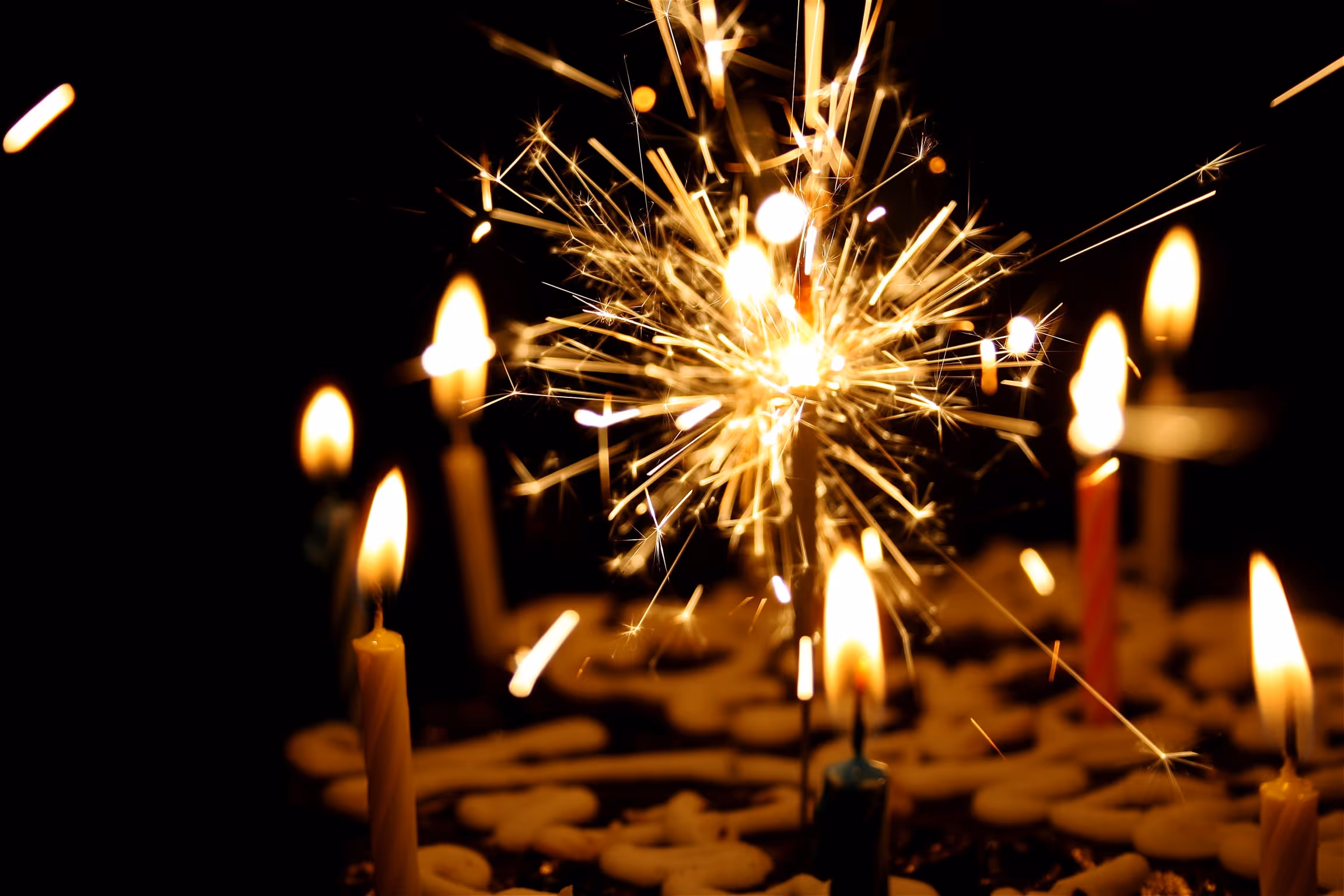 Sparkler and candles on a celebration cake at event location Zermatt Furi