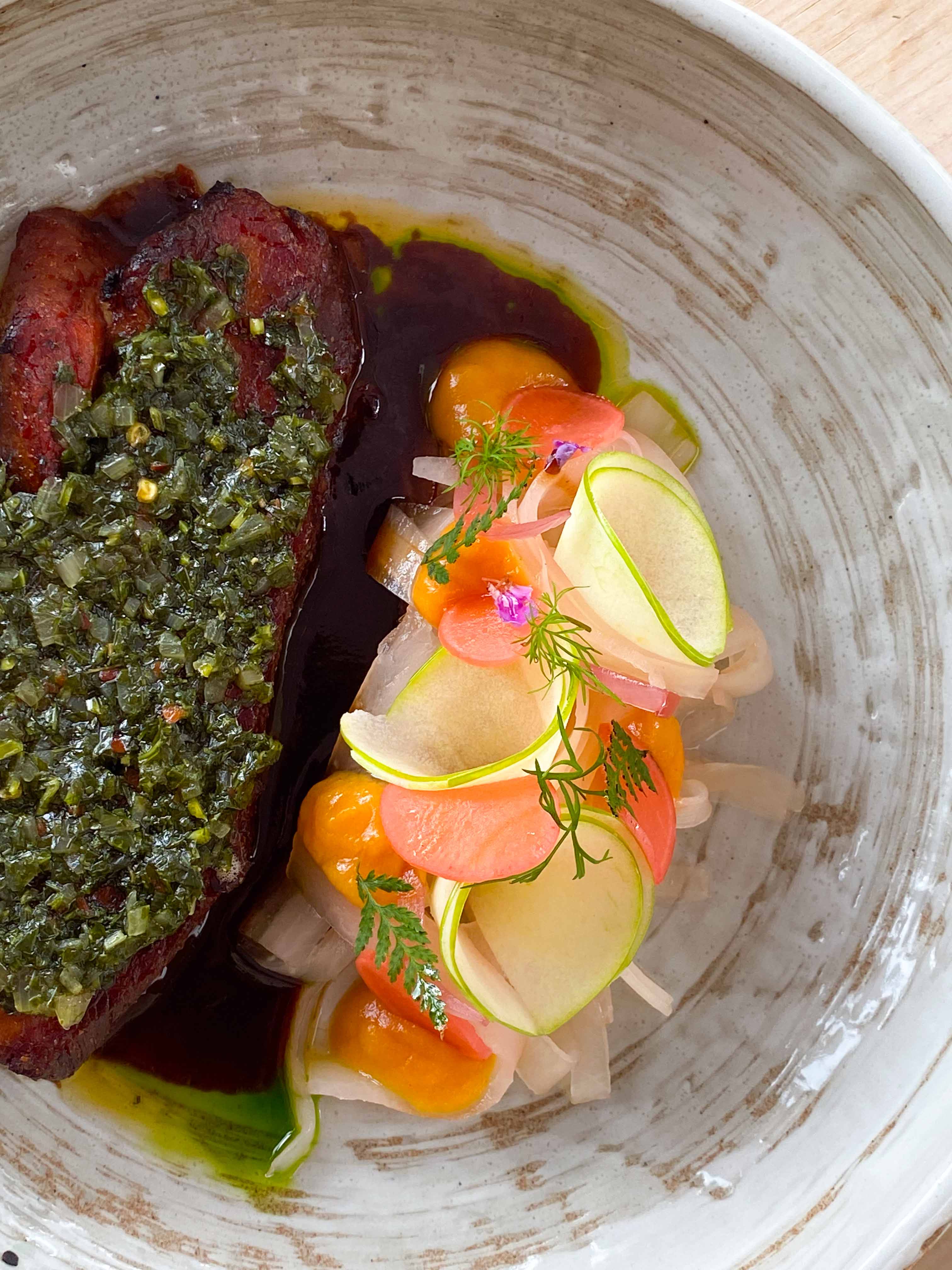 Beautifully plated gourmet vegetable dish with herb sauce at Restaurant Marmo Furi Zermatt