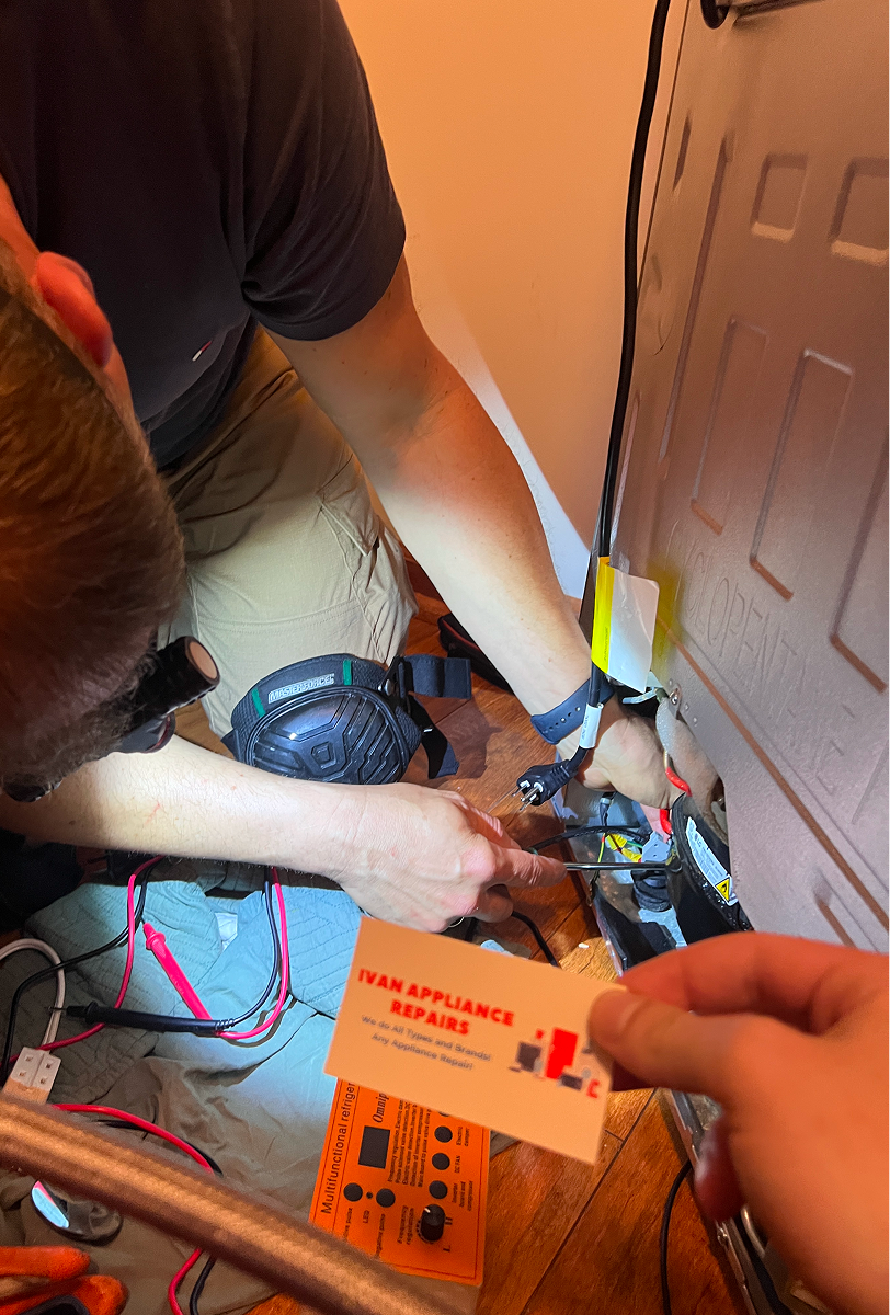 technician repairing a freezer