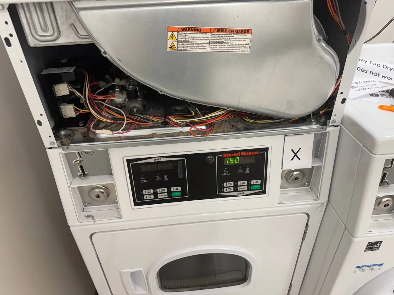 Appliance repair technician repairing a washer