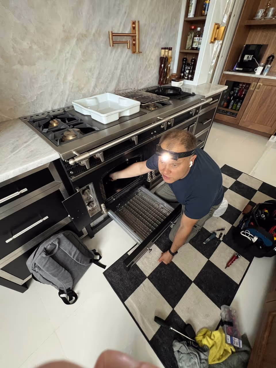 technician repairing a range