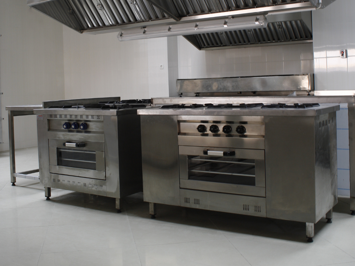 Commercial gas range and prep counter in restaurant kitchen