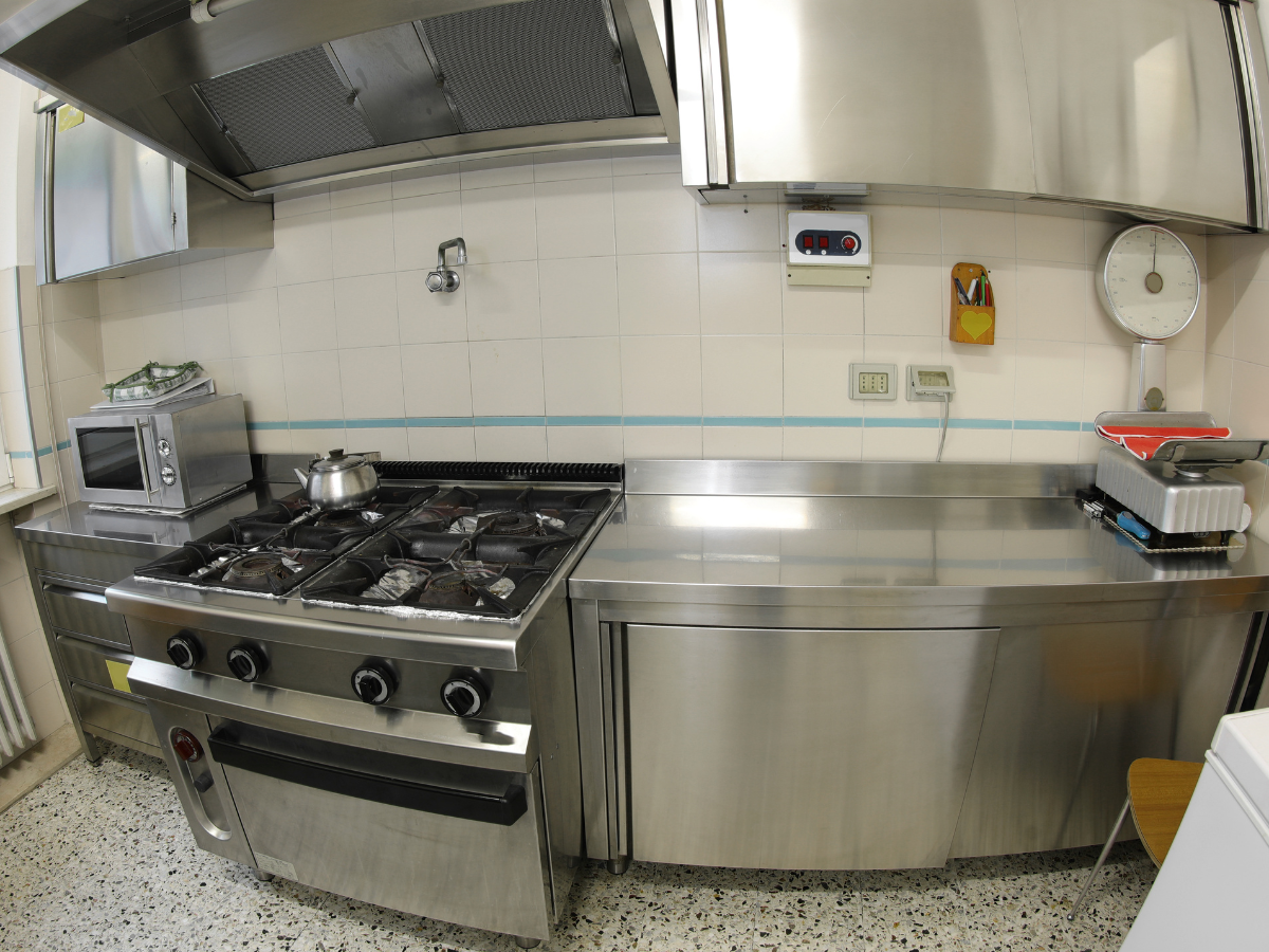 Stainless steel commercial gas range with oven