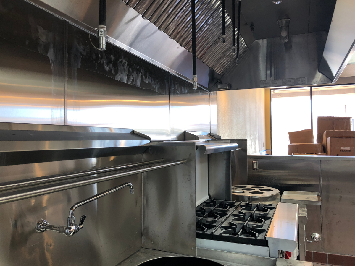 Commercial range and cooktop in restaurant kitchen