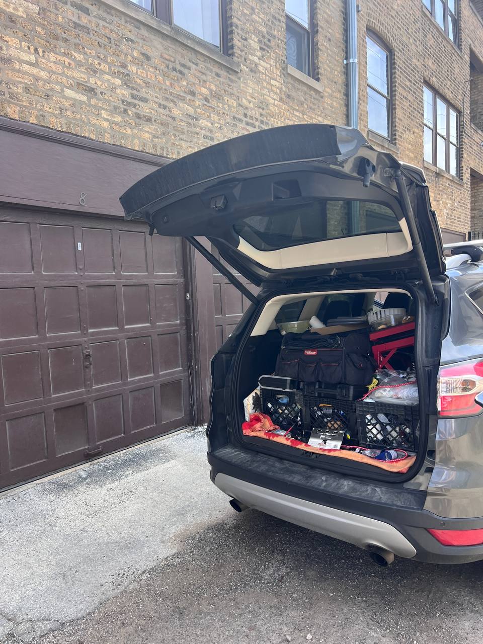 Appliance repair technician vehicle parked at customer location