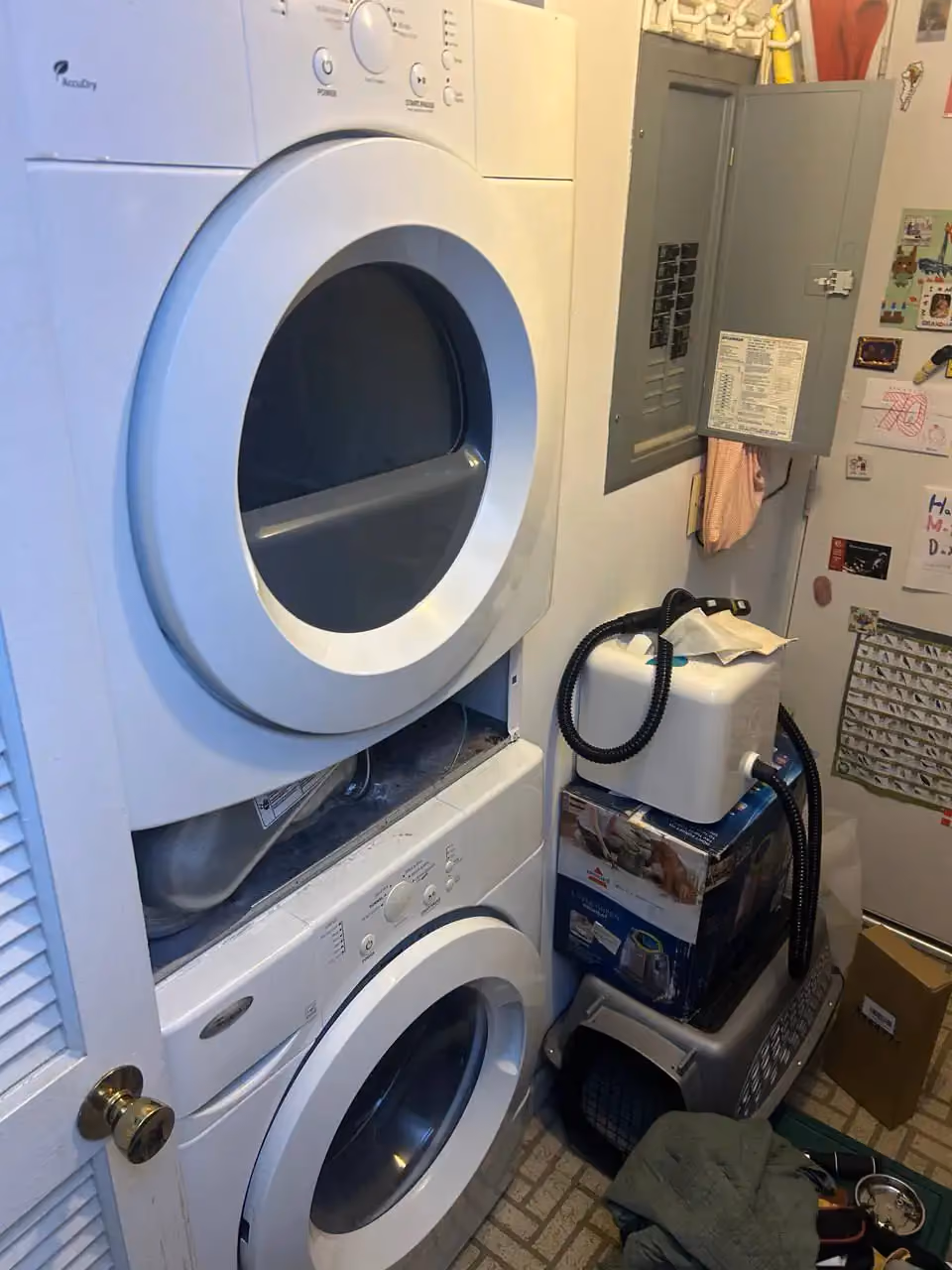 Appliance repair technician repairing a washer