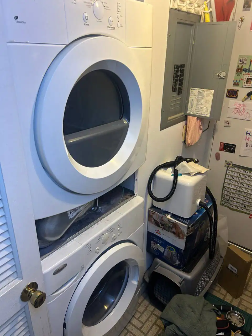 Appliance repair technician repairing a washer