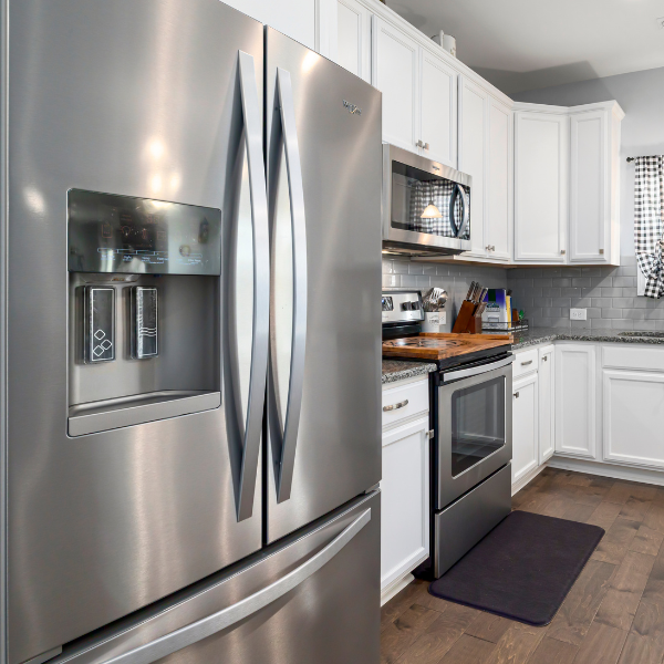 Appliance repair technician repairing a washer