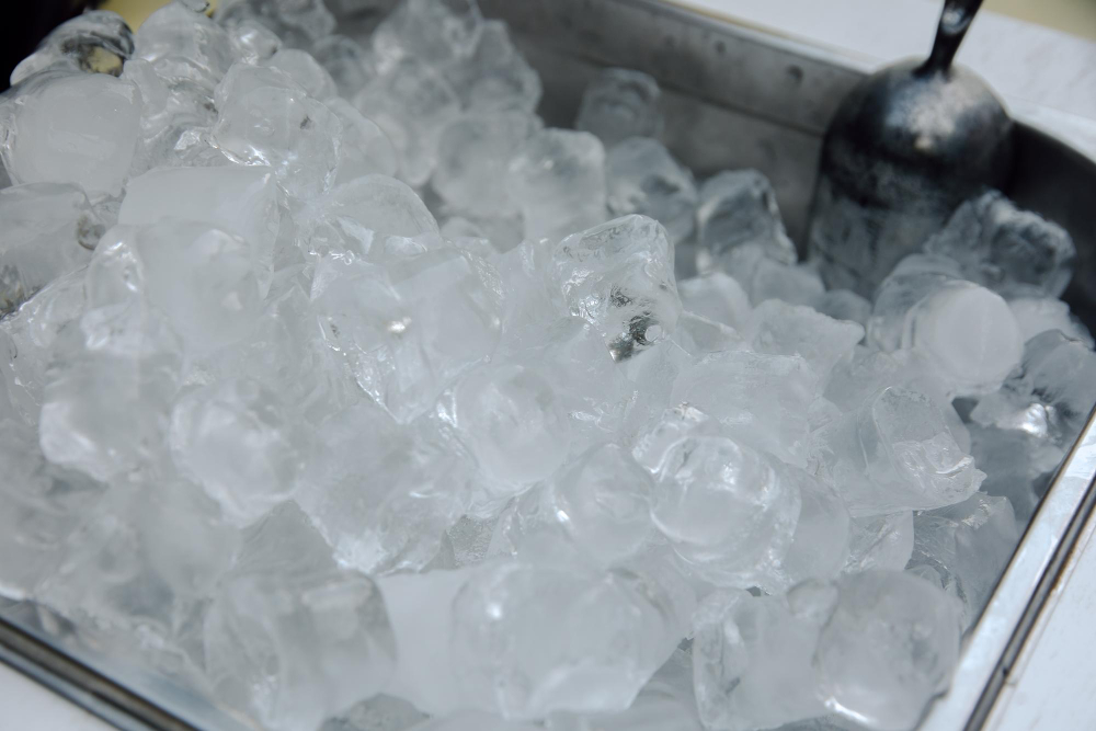 Commercial ice maker machine with ice production tray visible