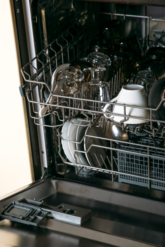 Dishwasher loaded with dishes inside kitchen appliance