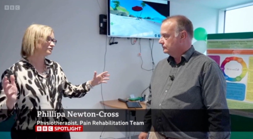 Screenshot from BBC Spotlight showing Phillipa Newton-Cross discussing the use of VR therapy for chronic pain management at Torbay Hospital.