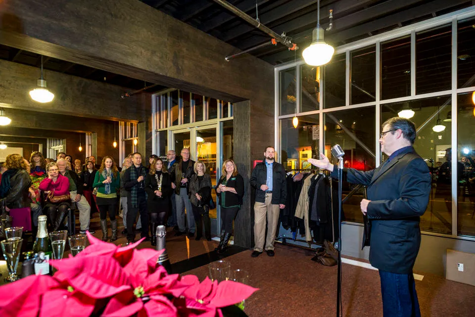Scott Nolte gives a champagne toast and thanks to the Taproot project team and donors.