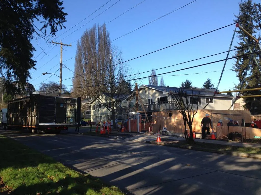 Backing the first module into the driveway on the challenging urban infill lot.