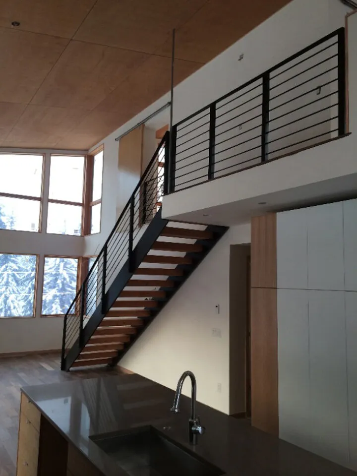 A view of the living area with double tall vaulted ceilings.