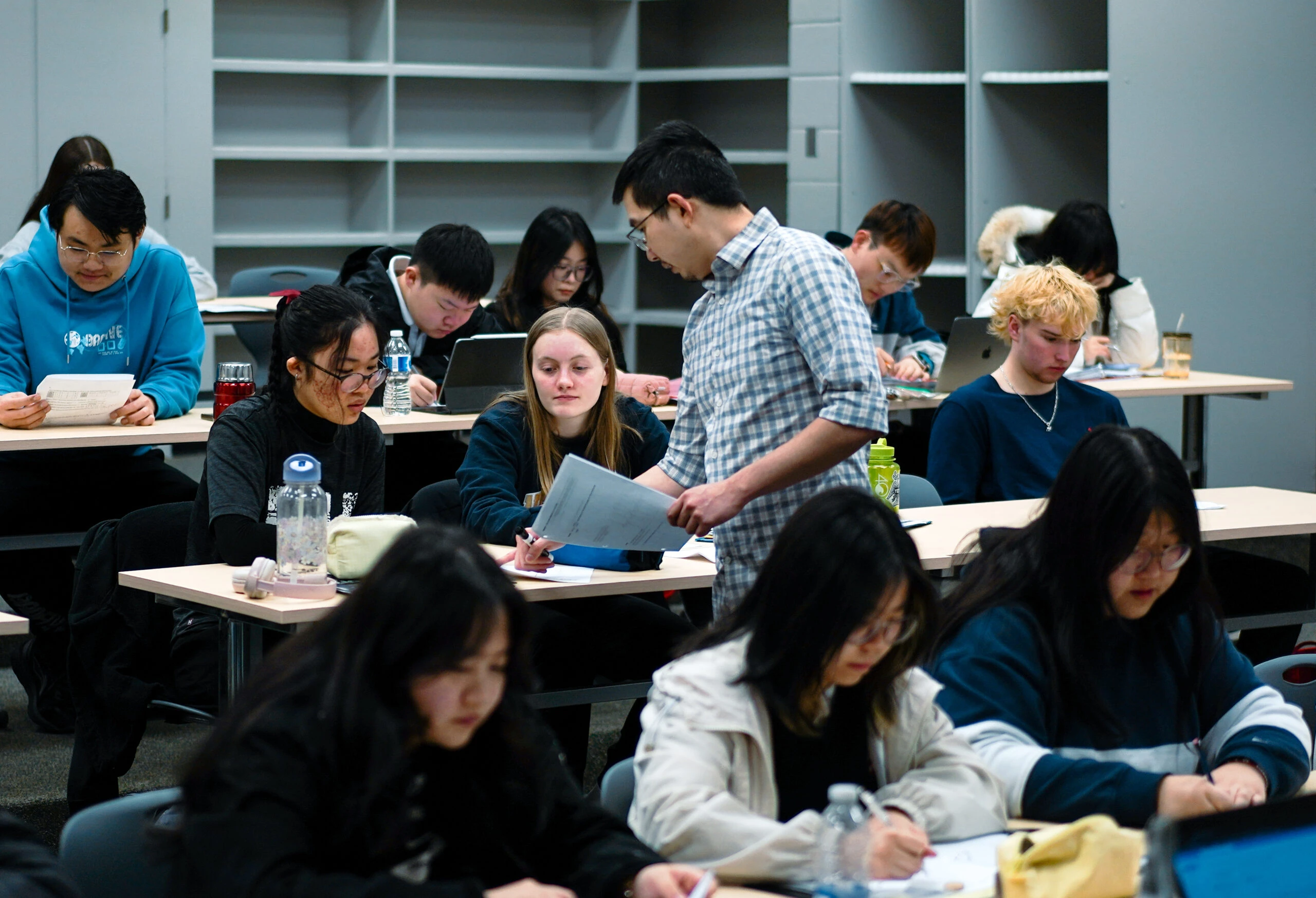 Students working at desks during a class