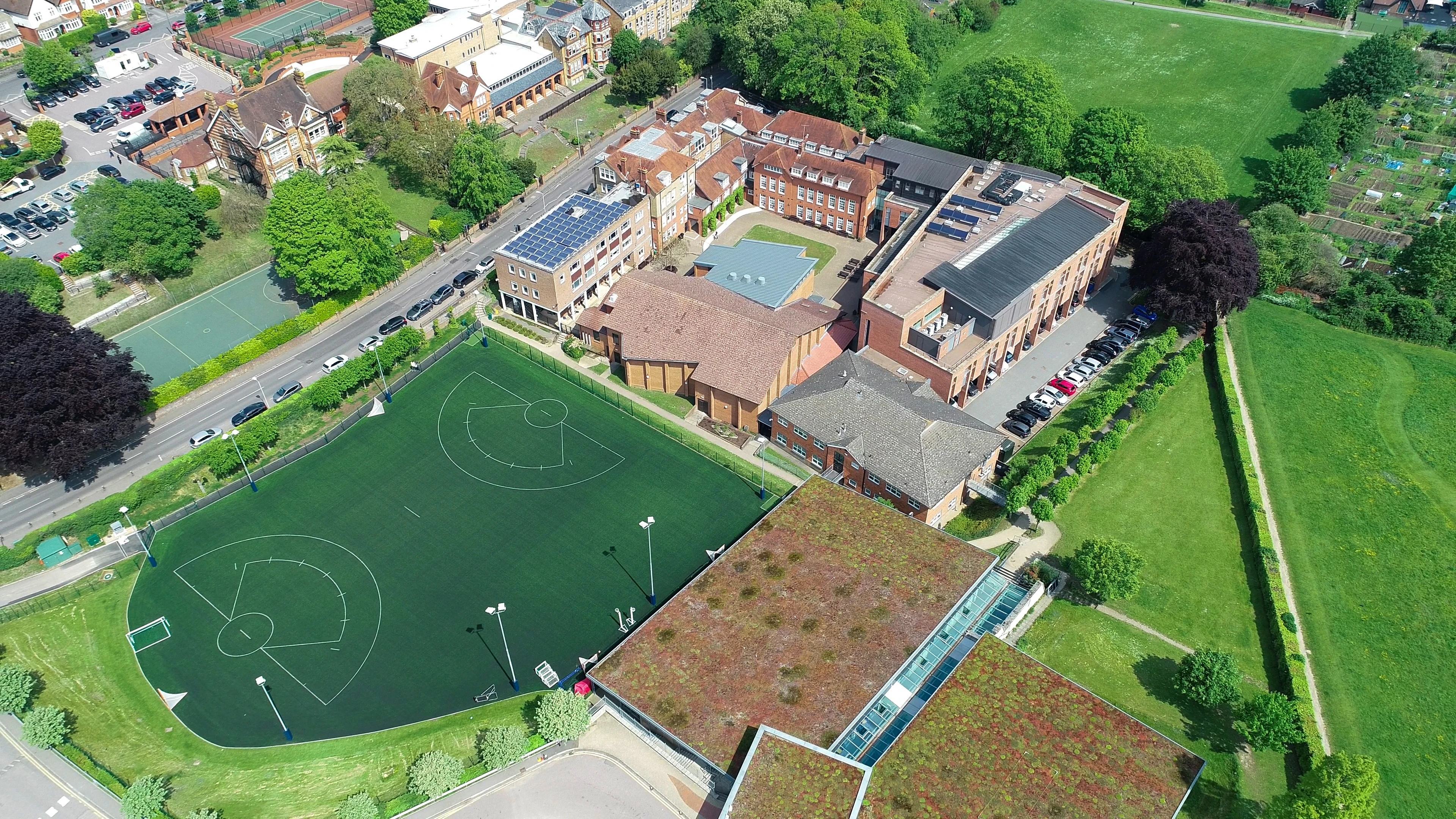 Aerial view of a school campus and sports pitches