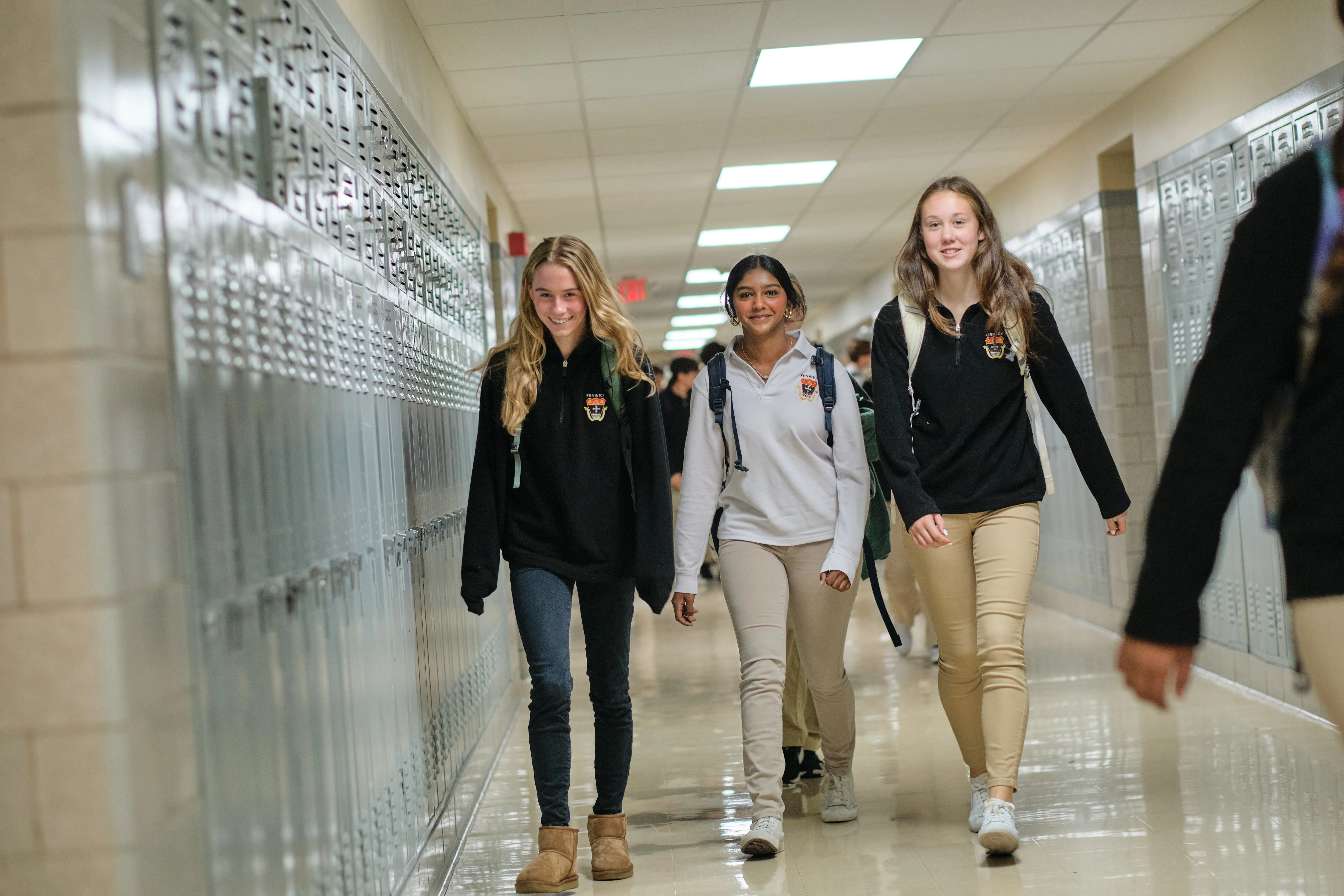 Bishop Fenwick students walking down a school corridor