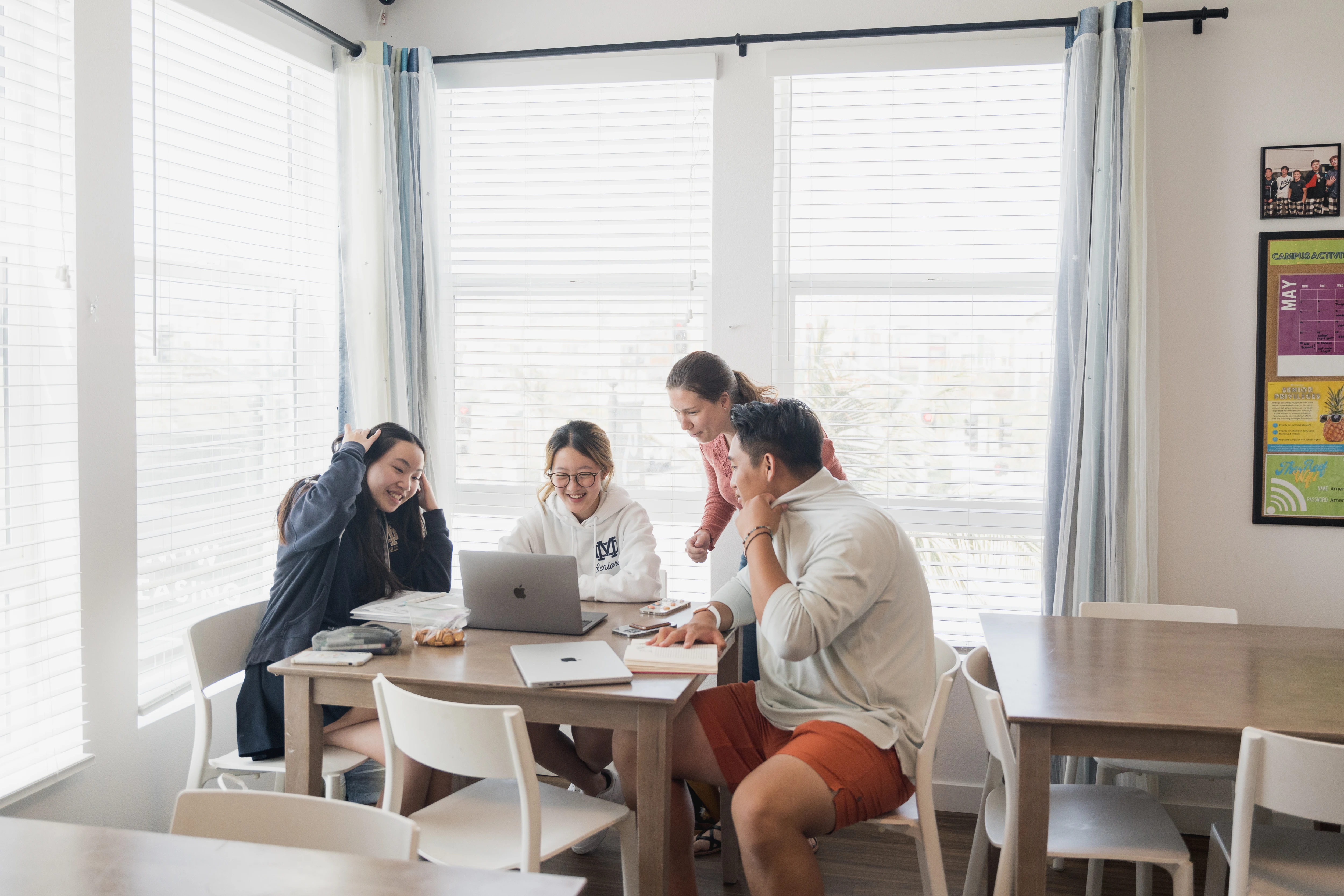 Students studying together in a residence common room