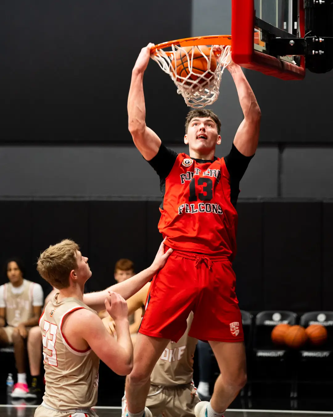 Fort Erie International Academy basketball player dunking during a game