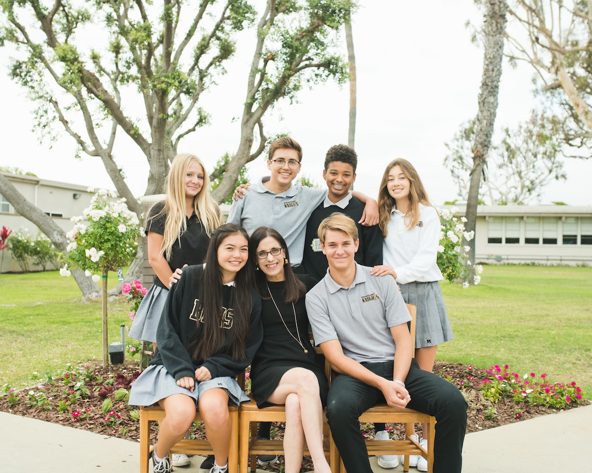 Bishop Montgomery High School students sitting together on a bench