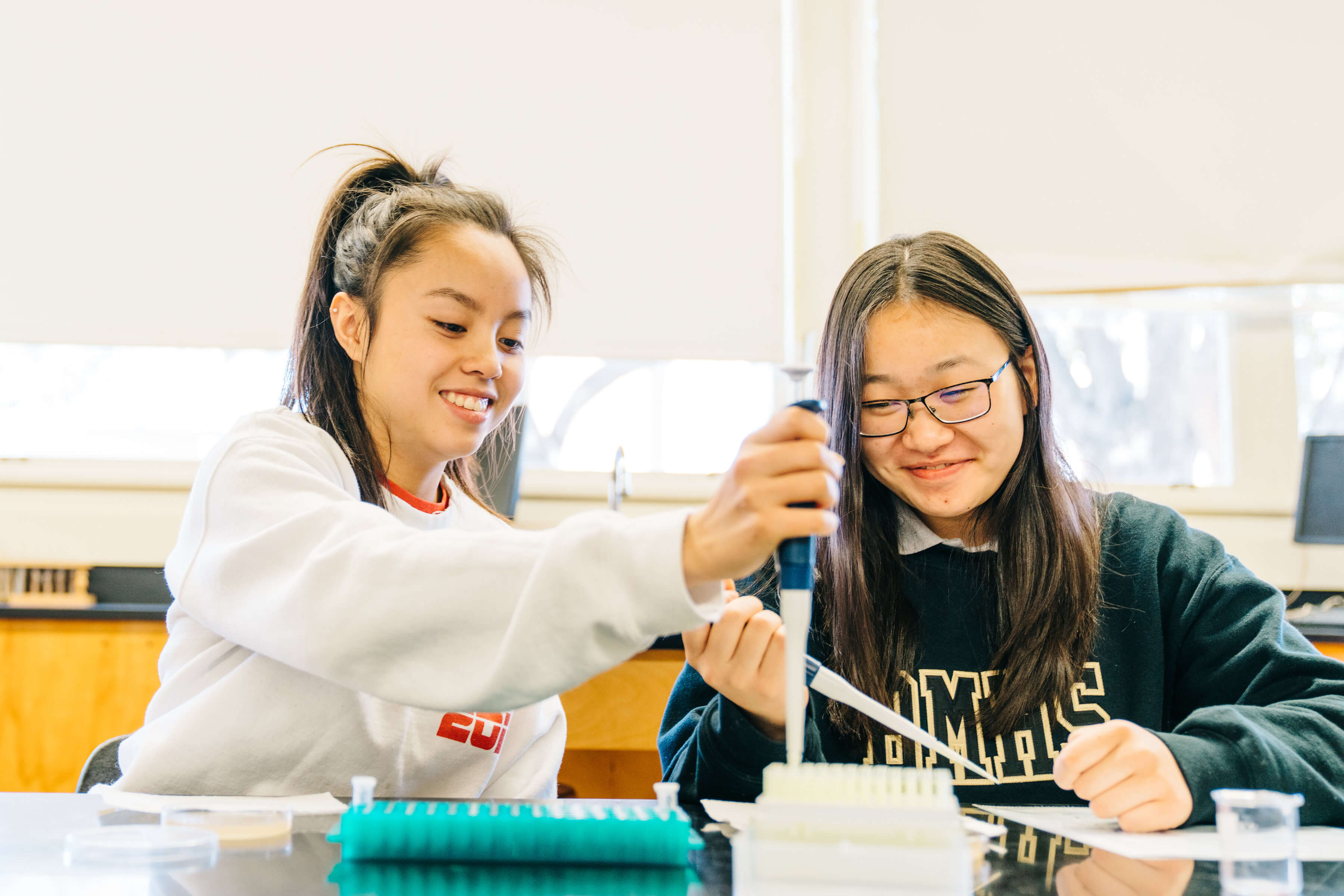 Bishop Montgomery students working with pipettes in the science lab
