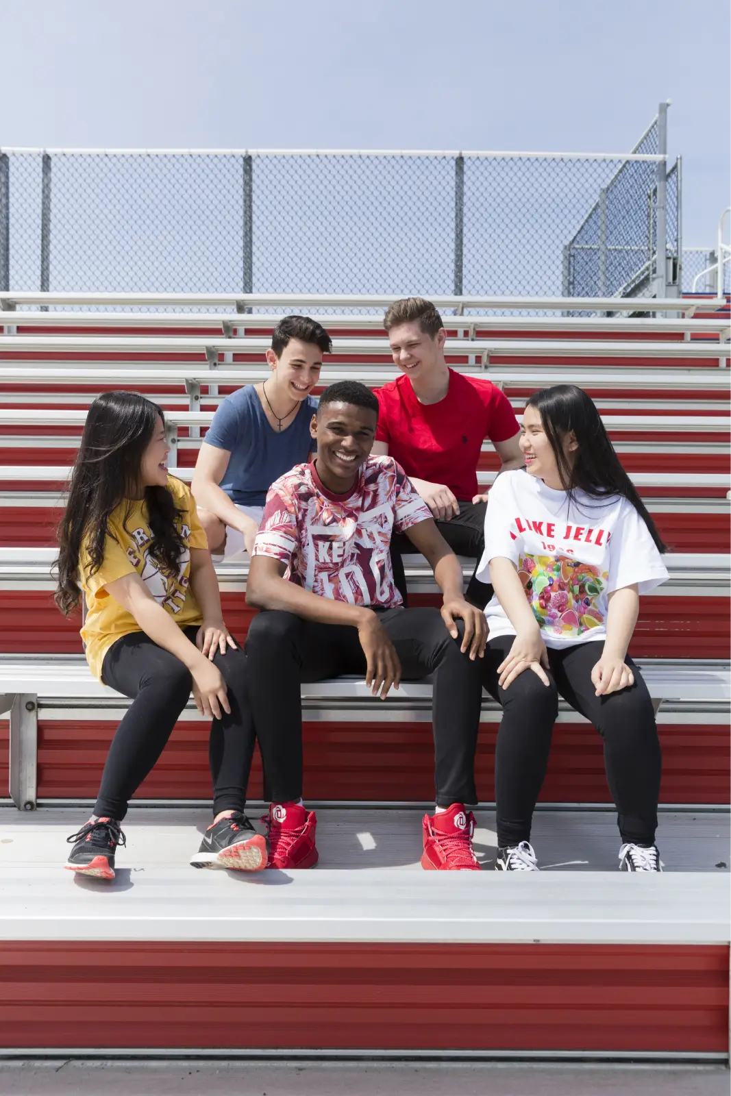 Saint John's High School students sitting together in the stands